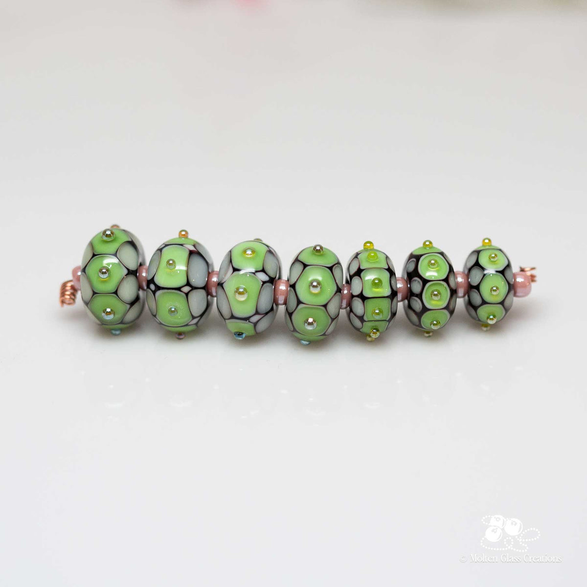 Sample - pale green dotted beads