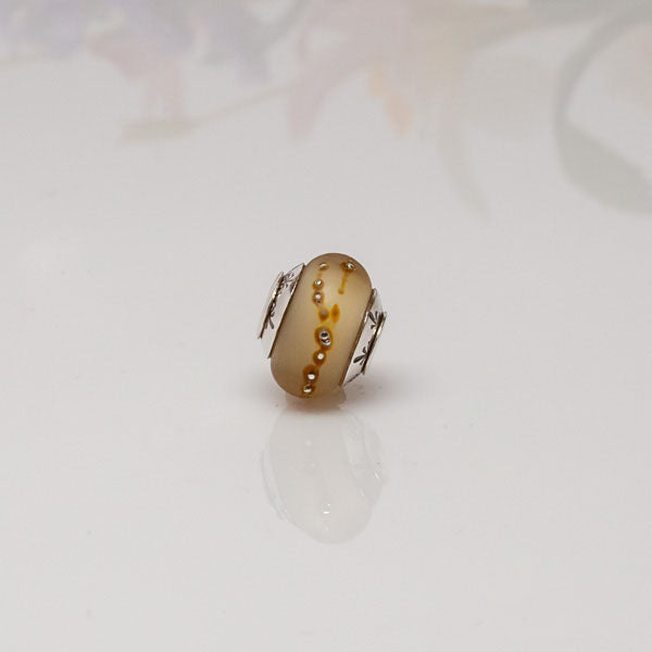 big hole bead amber fleur de lis